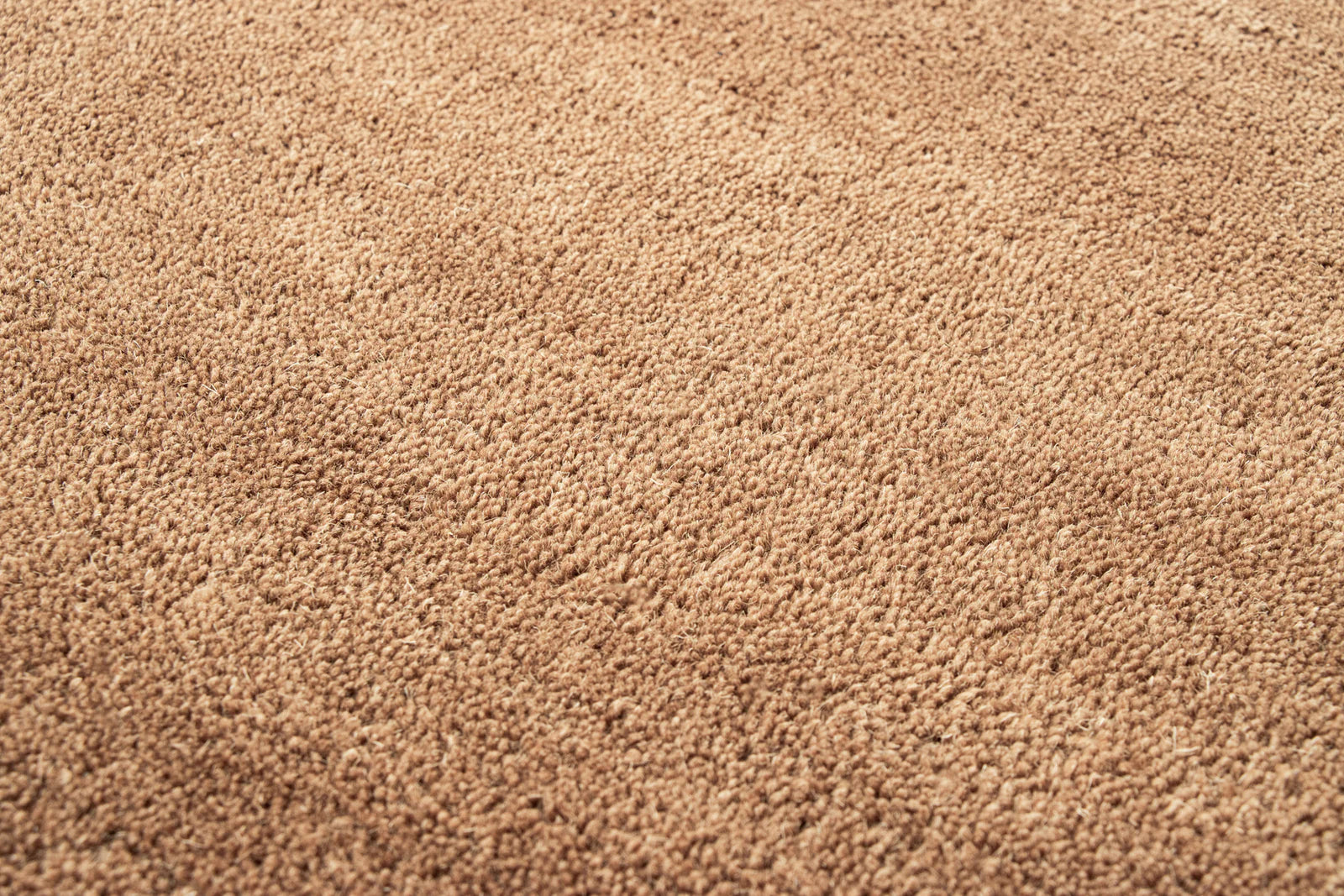 Close-up of brown hand-tufted New Zealand wool texture