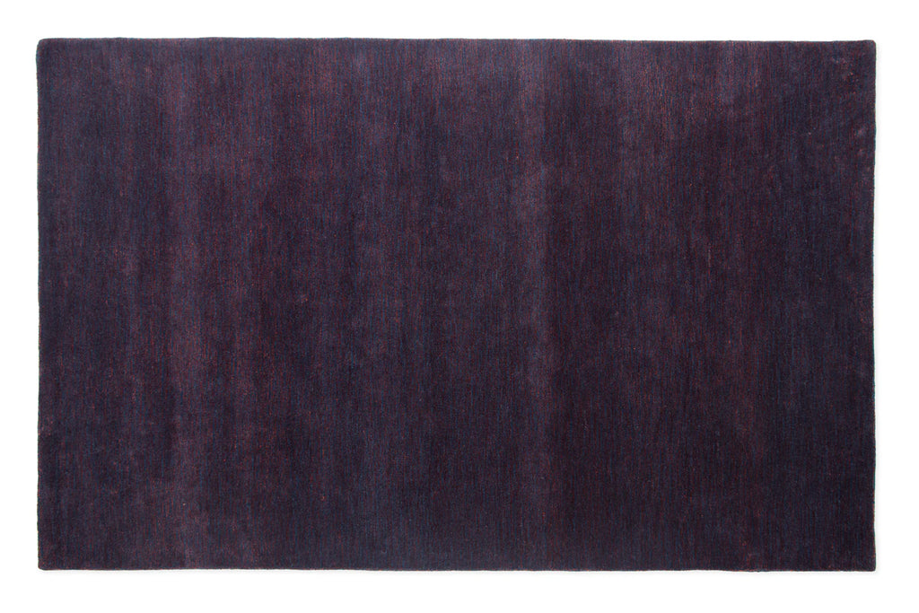 Bordeaux purple area rug on white background