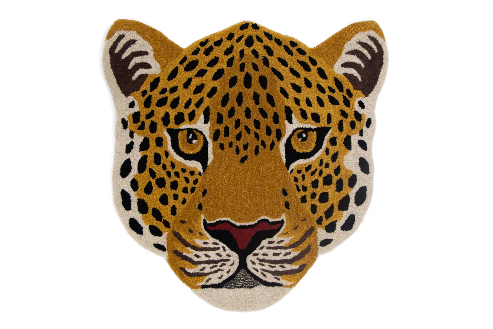 A hand-tufted wool rug featuring a jaguar's face in rich colors with attention to detail, primarily in a natural setting.